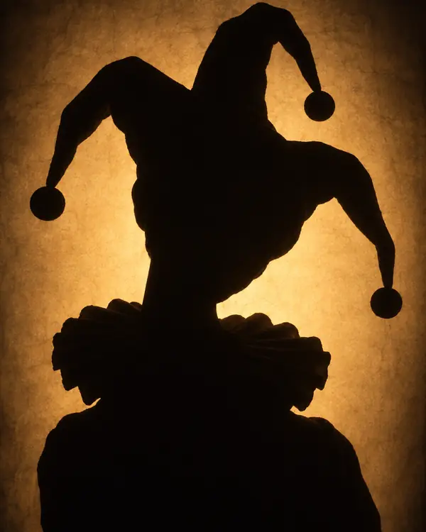 A player not revealed yet: a shadow behind a lit screen